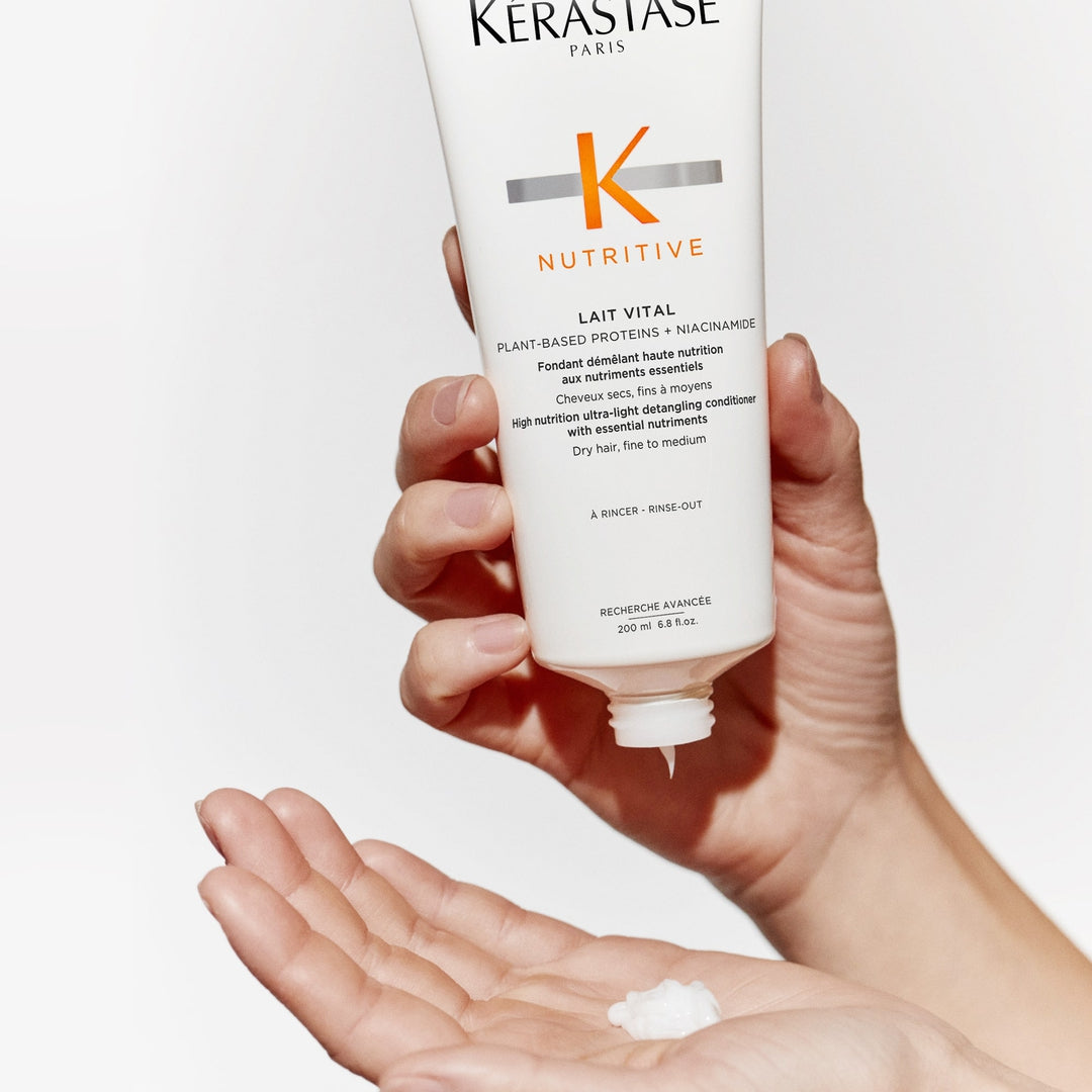 Kerastase Nutritive Lait Vital Conditioner in hand