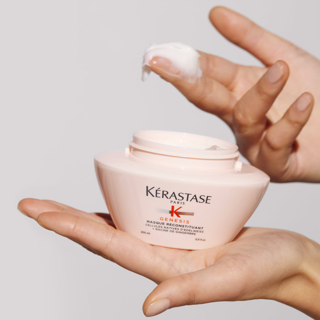kerastase genesis masque reconstituant hair mask product in hand