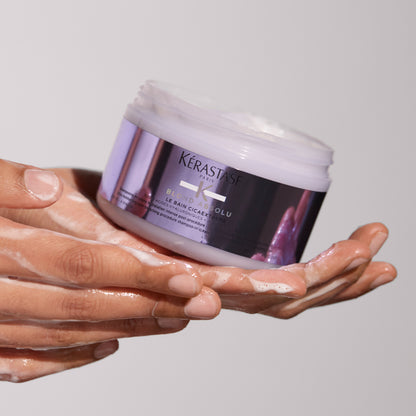 kerastase blond absolu le bain cicaextreme shampoo product in hand