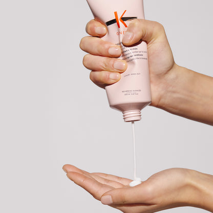 kerastase genesis fondant renforcateur conditioner product in hand