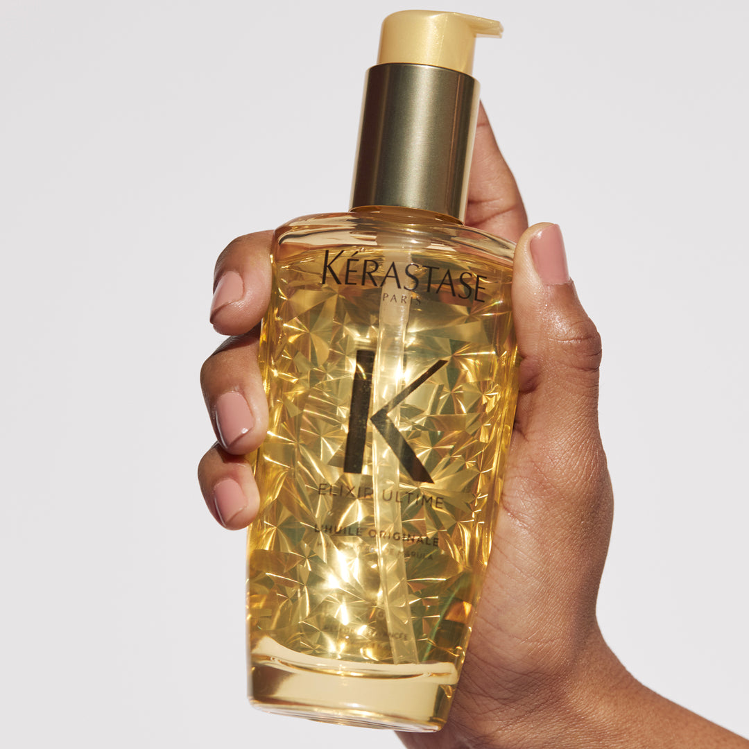 Kerastase Elixir Ultime L'Huile Original Hair Oil in hand