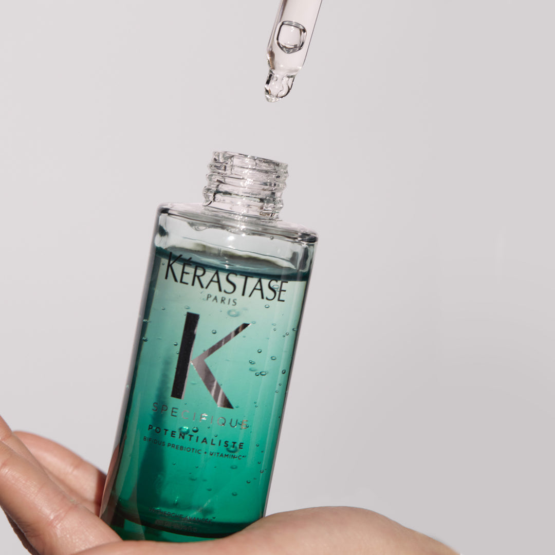 Kerastase Specifique Potentialiste Hair and Scalp Serum product in hand